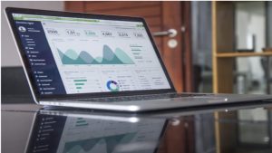 Data displayed on laptop screen demonstrating self service BI strategy
